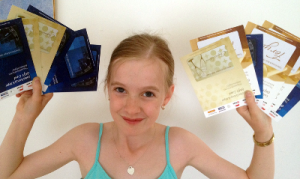 Girl holding gift cards